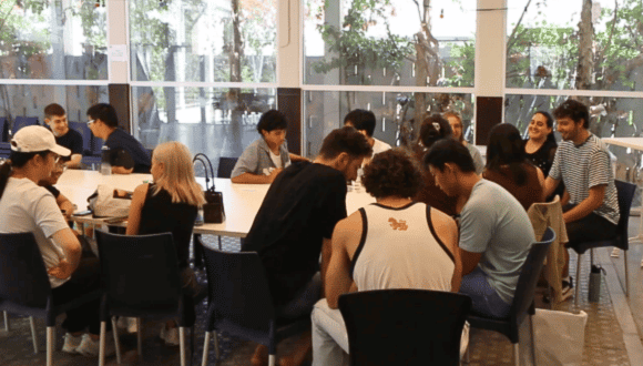 Chinese and Israeli students in conversation at a gathering at the Lowy International School, Tel Aviv University